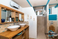 Appartement atypique de 86 m2 avec une terrasse privative de 50 m2 sur les toits 4 chambres, 2 places de parking.