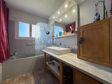 Maison avec rendement locatif, piscine et garage