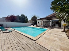 Maison avec rendement locatif, piscine et garage