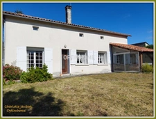 ensemble de 2 maisons en pierre + grange + grand terrain 
