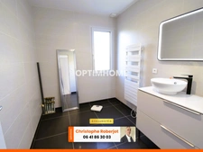Maison de plain pied avec 3 chambres posée sur 1000m2 - RT 2012