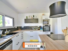 Maison de plain pied avec 3 chambres posée sur 1000m2 - RT 2012
