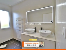 Maison de plain pied avec 3 chambres posée sur 1000m2 - RT 2012