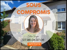 Maison avec 3 chambres, un jardin, deux parkings et un garage fermé.