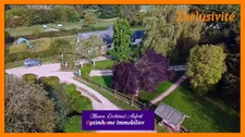 Ecurie avec 3 maisons sur 4 hectares proposant de nombreuses installations (boxes, manèges, carrières) dans l'Eure à 15min de L'Aigle 