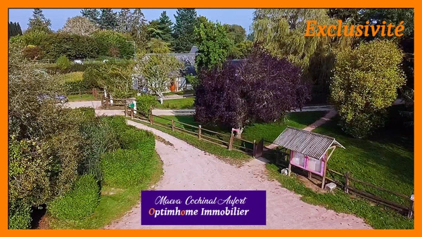 Ecurie avec 3 maisons sur 4 hectares proposant de nombreuses installations (boxes, manèges, carrières) dans l'Eure à 15min de L'Aigle 