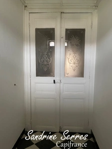 A vendre ALZONNE Charmante maison de village en pierre T 8 , grenier, garage et cour intérieure . 