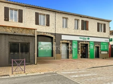 A vendre St Génis des Fontaines (66)  murs commerciaux loués Enseigne nationale de renom.