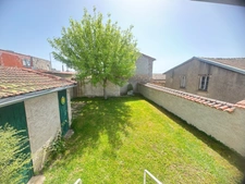 In the heart of the village, charming house with enclosed garden