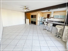 Townhouse for sale in Vic-Fezensac (32), divided into 2 rented apartments, with terrace, balcony, and garage.