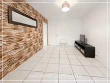 Townhouse for sale in Vic-Fezensac (32), divided into 2 rented apartments, with terrace, balcony, and garage.