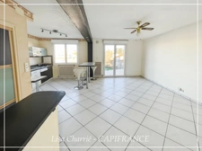 Townhouse for sale in Vic-Fezensac (32), divided into 2 rented apartments, with terrace, balcony, and garage.