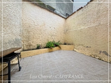 Townhouse for sale in Vic-Fezensac (32), divided into 2 rented apartments, with terrace, balcony, and garage.