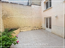 Townhouse for sale in Vic-Fezensac (32), divided into 2 rented apartments, with terrace, balcony, and garage.