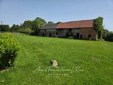 Terrain de 1750 M2 constructible à Duranville avec un grand bâtiment à rénover