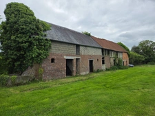 Terrain de 1750 M2 constructible à Duranville avec un grand bâtiment à rénover