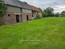 Terrain de 1750 M2 constructible à Duranville avec un grand bâtiment à rénover