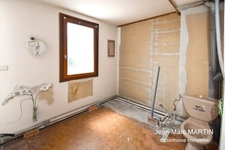 À vendre à Houplines : maison 4 pièces de 83 m² avec garage, idéale pour un projet de rénovation