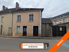 Belle Opportunité en Centre-Ville de Bellême : Maison à Restaurer avec Jardin et Garage