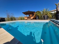 Prestation qualitative : Plain-Pied de 125 m2, parcelle paysagée de 1400 m2, piscine et paillotte