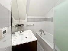 Beautiful penthouse apartment, 68m2 of floor space, with balcony - 2 bedrooms, sold with cellar, garage and outdoor parking in the village centre