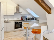 Beautiful penthouse apartment, 68m2 of floor space, with balcony - 2 bedrooms, sold with cellar, garage and outdoor parking in the village centre