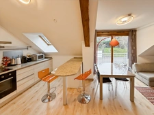 Beautiful penthouse apartment, 68m2 of floor space, with balcony - 2 bedrooms, sold with cellar, garage and outdoor parking in the village centre