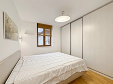 Beautiful penthouse apartment, 68m2 of floor space, with balcony - 2 bedrooms, sold with cellar, garage and outdoor parking in the village centre