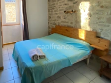 Maison de village en pierre 220 m² – 6 suites – cachet et potentiel à Vagnas, proche de Vallon-pont-d'Arc