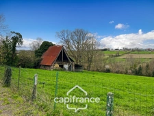 Country house of 133 m², 4 bedrooms with outbuildings, land and woods