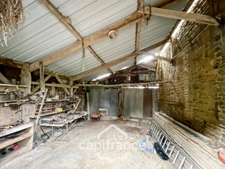 Country house of 133 m², 4 bedrooms with outbuildings, land and woods