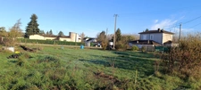 Terrain à bâtir avec ancien jardin en permaculture – cadre paisible, à deux pas du bourg