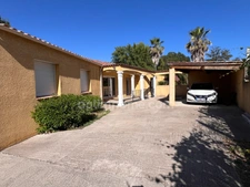 Maison de plain-pied 155 m² avec garage de 92m2, piscine et terrain arboré à MONTAGNAC (34)