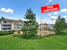 VOURLES - 2-bedroom apartment of 67m² with a magnificent terrace, in a secure residence with a swimming pool and park