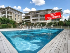 VOURLES - 2-bedroom apartment of 67m² with a magnificent terrace, in a secure residence with a swimming pool and park