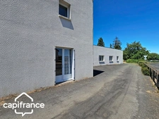 Local d’activité 260 m² + logement 132 m² – parking privé – terrain 1 690 m² – forte visibilité – Thouars (79100)
