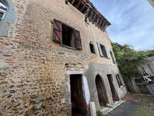 Hautes-Pyrénées (65), for sale in Trie-sur-Baïse: 2 large garages of 71 m² and 82 m² + upper floors on a total plot of 153 m², in the town center, in a quiet location
