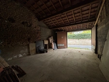 Hautes-Pyrénées (65), for sale in Trie-sur-Baïse: 2 large garages of 71 m² and 82 m² + upper floors on a total plot of 153 m², in the town center, in a quiet location