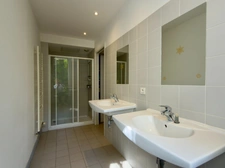 Elegant 2-bedroom apartment with private paved courtyard and secure parking.