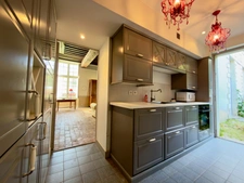 Elegant 2-bedroom apartment with private paved courtyard and secure parking.