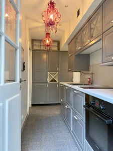 Elegant 2-bedroom apartment with private paved courtyard and secure parking.