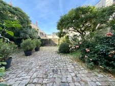 Elegant 2-bedroom apartment with private paved courtyard and secure parking.