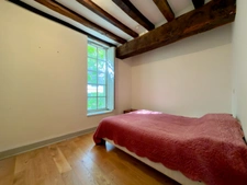Elegant 2-bedroom apartment with private paved courtyard and secure parking.