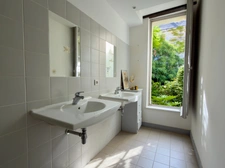 Elegant 2-bedroom apartment with private paved courtyard and secure parking.