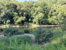 House on the edge of the lot with river access