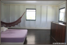 A VENDRE A KOUROU (GUYANE FRANCAISE) UNE CHARMANTE PROPRIETE DE 486 m² - DEUX APPARTEMENTS T3 - UN STUDIO - SUPERFICIE DU TERRAIN DE 5000 m² - AU PRIX DE 427000 €.
