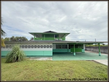 A VENDRE A KOUROU (GUYANE FRANCAISE) UNE CHARMANTE PROPRIETE DE 486 m² - DEUX APPARTEMENTS T3 - UN STUDIO - SUPERFICIE DU TERRAIN DE 5000 m² - AU PRIX DE 427000 €.