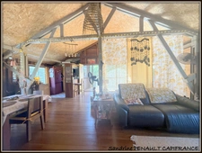 A VENDRE A KOUROU UNE CHARMANTE MAISON T5 EN BOIS DE 133 m² SUPERFICIE TERRAIN 2 HECTARES - AU PRIX DE 346 500 €.