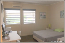 A VENDRE A KOUROU (97310) UNE MAGNIFIQUE MAISON EN BOIS T5 de 106 m² AVEC 2 MAISONS T2 INDEPENDANTES - TERRAIN DE 775 m² - AU PRIX DE 407 000 €.  