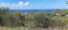 Baillif. Terrain 1095 m2 avec vue mer exceptionnelle